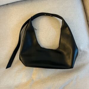 Elegant Black Leather Hobo Bag with adjustable straps